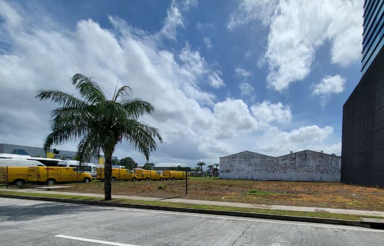 Vacant commercial development land with neighboring industrial and corporate facilities in Panama