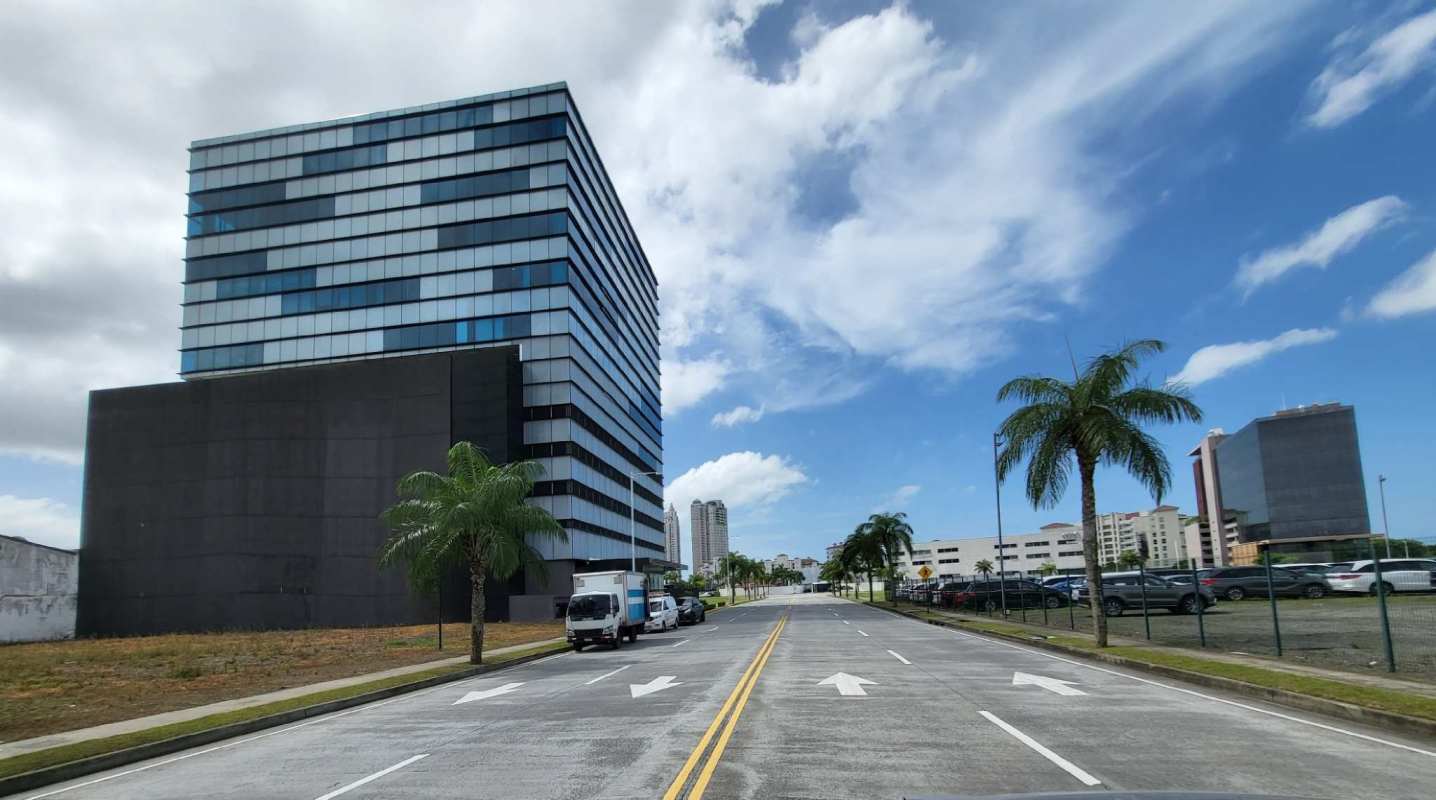 View of neighboring office towers near vacant commercial lot in Santa Maria Panama