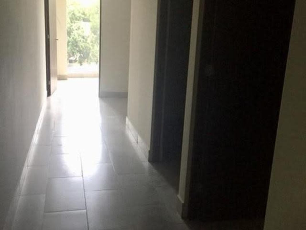 Bright modern hallway with tiled floor inside PH Denovo commercial building in Obarrio Panama City