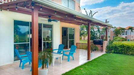 Bright open living and dining room with sliding doors to patio in Costa Blanca Villas Panama