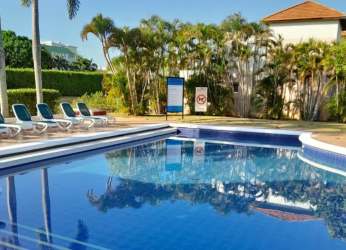 Bedroom with glass door balcony and garden views at Costa Blanca Villas Panama