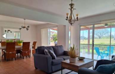 Patio terrace with tropical landscaping and golf course backdrop Costa Blanca Villas Panama