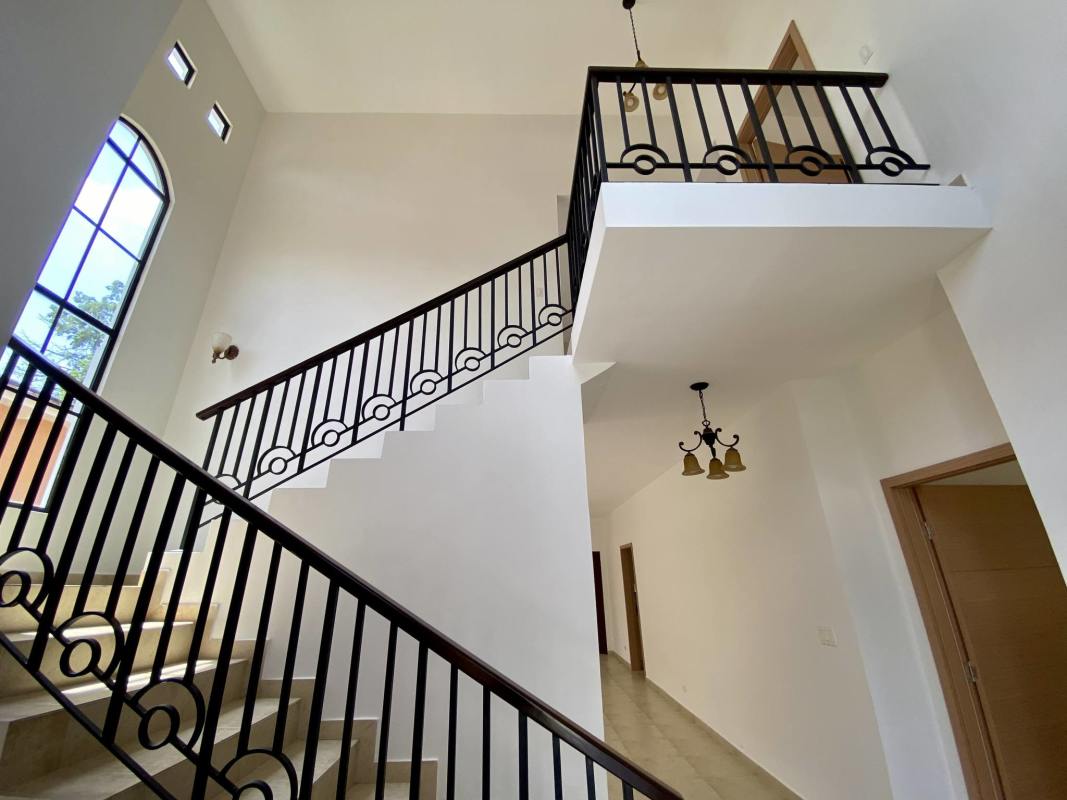 Spacious living room natural light arched windows tile floor Clayton Panama