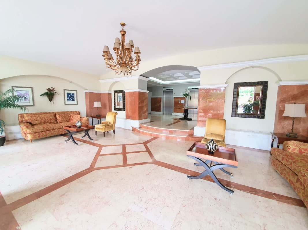 Outdoor swimming pool with lounge chairs and palm landscape at PH Mystic Point Punta Pacifica Panama City