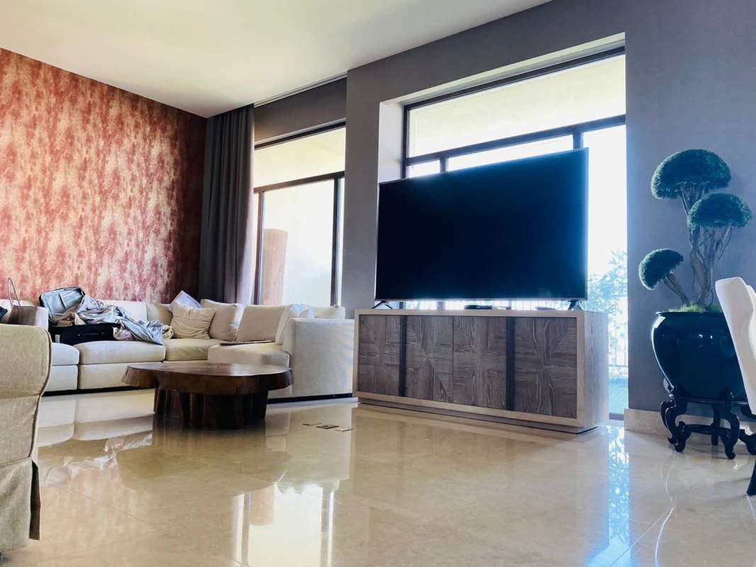 Spacious master bedroom with tufted headboard, balcony access, city view in Santa María Court penthouse Panama City