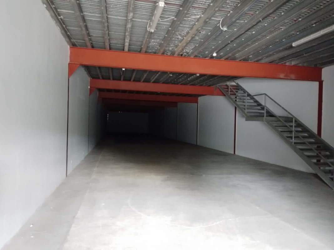 Exterior warehouse loading bays with roll-up metal doors, concrete yard in Balzac Industrial Park Juan Díaz Panama