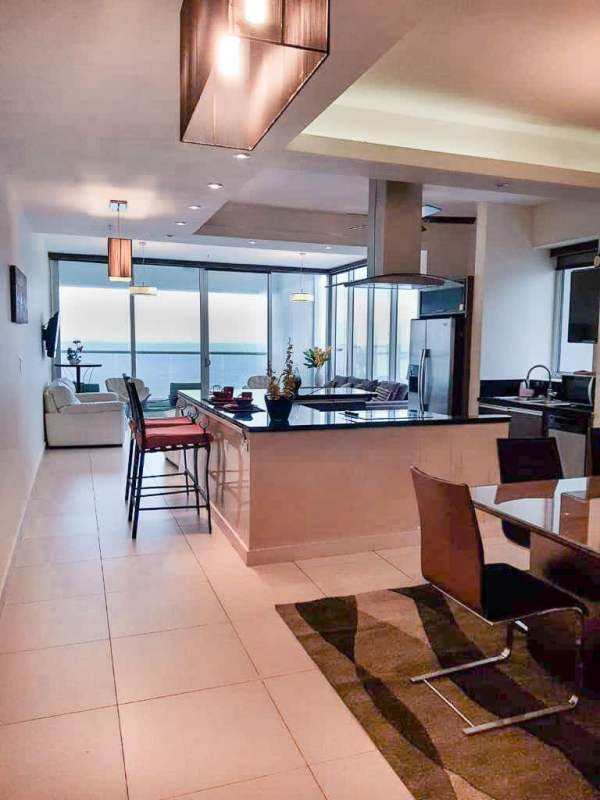 Master bedroom with Pacific Ocean view, large window and walk-in closet in PH Rivage Panama