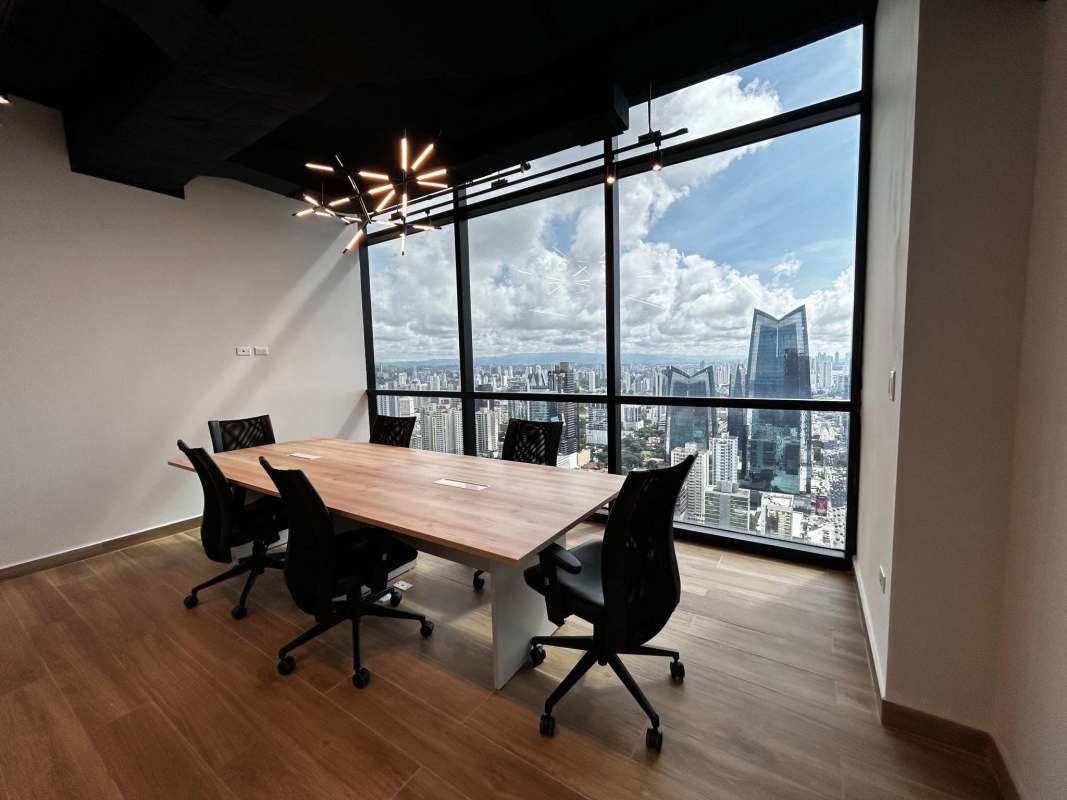 Modern conference room with skyline views glass walls wooden floor in Tower Financial Center Panama