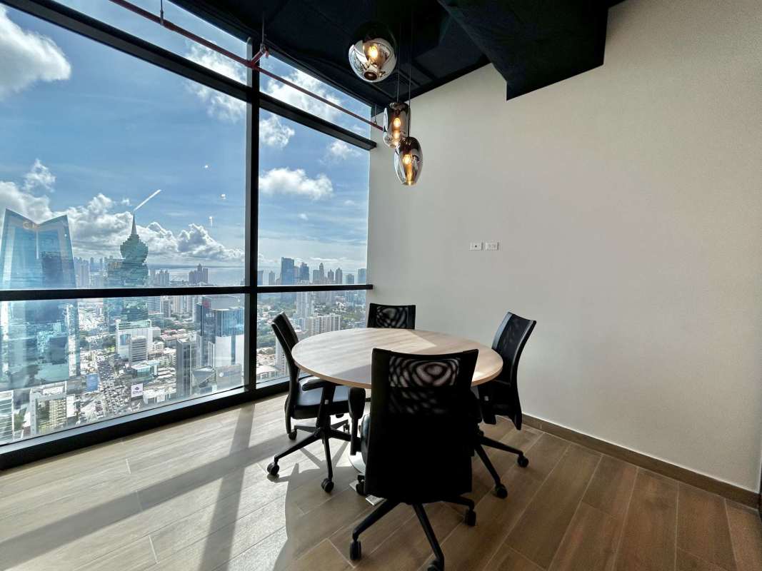 Furnished private office with desk chairs floor-to-ceiling windows city view Tower Financial Center Panama