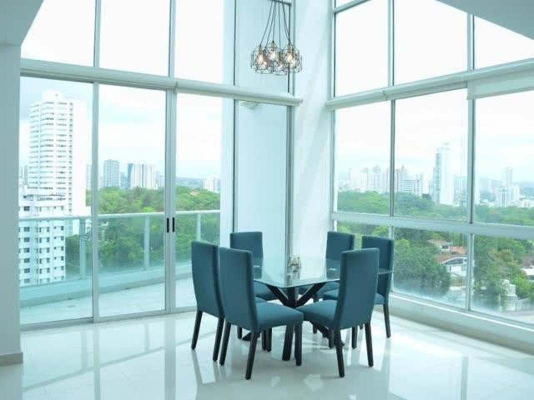 Loft bedroom with built-in closet and city skyline view PH Park Loft Via Porras