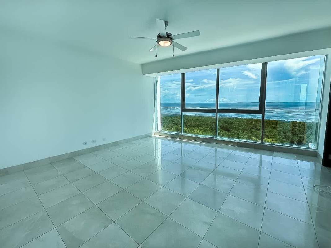 Bright bedroom with large windows, tile floors, ceiling fan at PH Ocean Two Costa del Este Panama