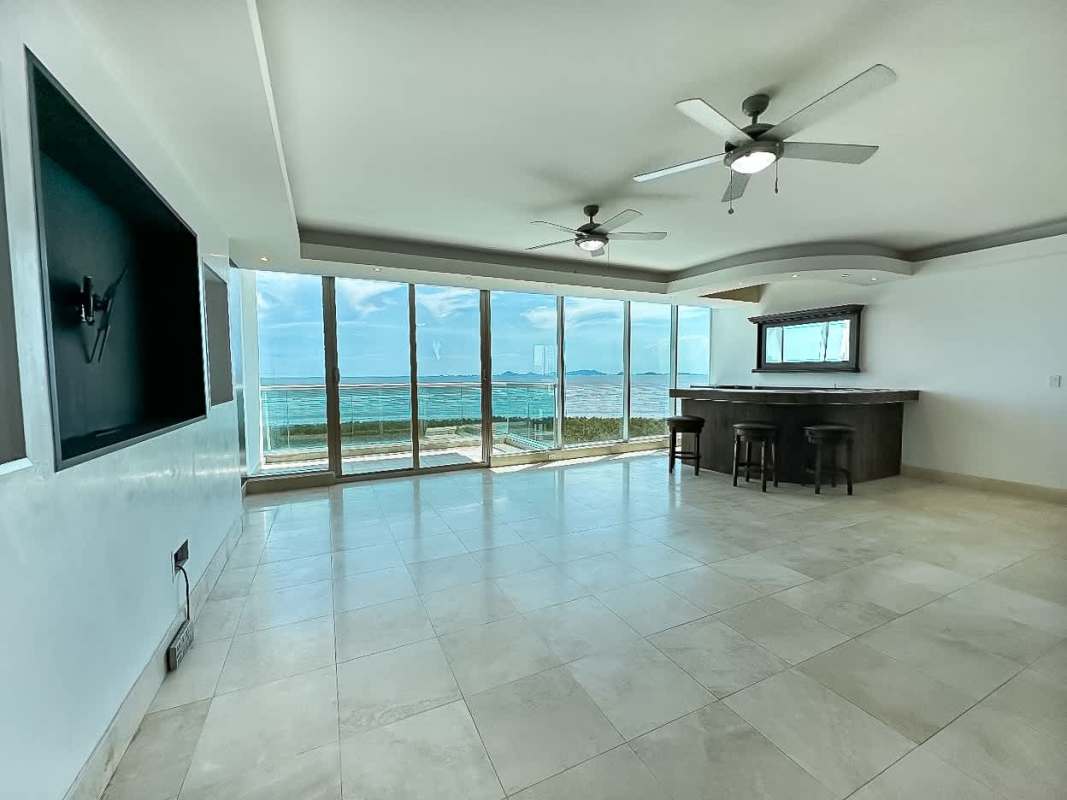 Open-plan living dining area with floor-to-ceiling ocean view windows PH Ocean Two Panama