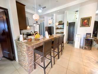 Kitchen with breakfast bar, granite counters in Hacienda Pacífica San Carlos House