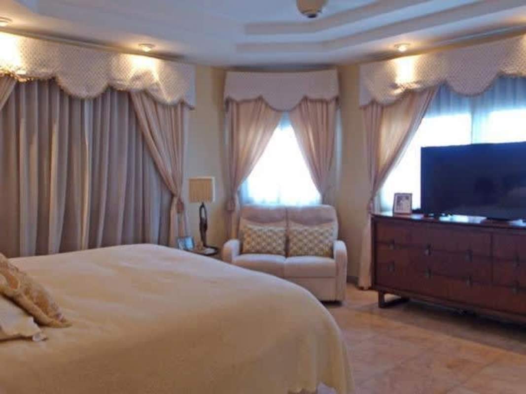 Recreational game room with pool table and large windows in upscale Panama City residence