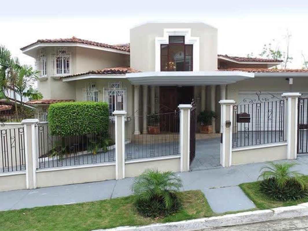 Exterior front view with balcony, gate, and Mediterranean architecture in Dos Mares Panama estate