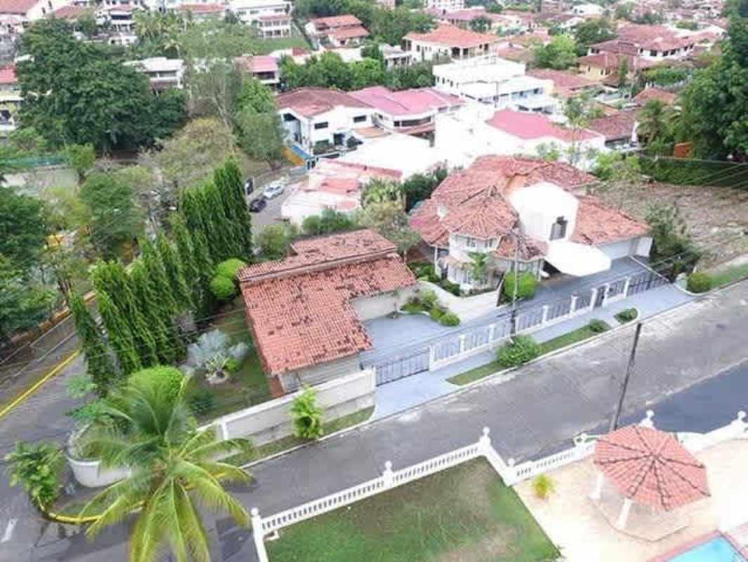 Aerial neighborhood view with Mediterranean-style homes with terracotta roofs and private pools in Dos Mares Panama