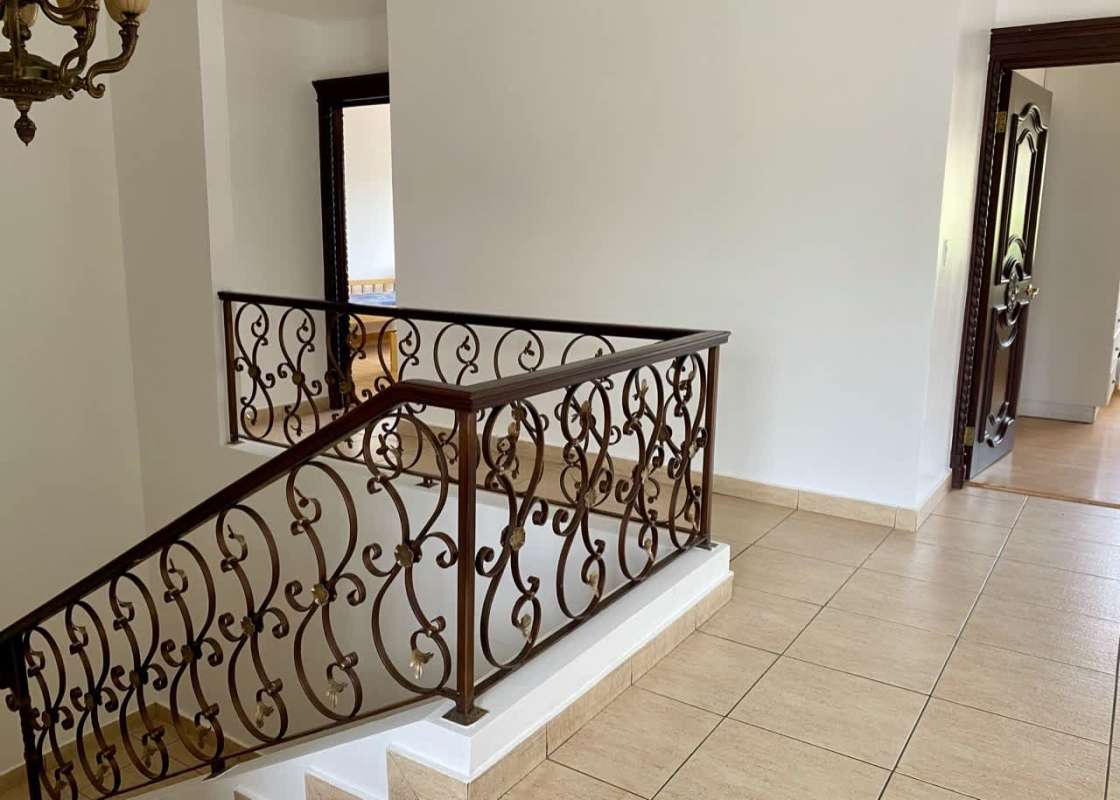 Luxury backyard pool with attached jacuzzi stone deck tropical plants Costa Dorada Costa del Este Panama