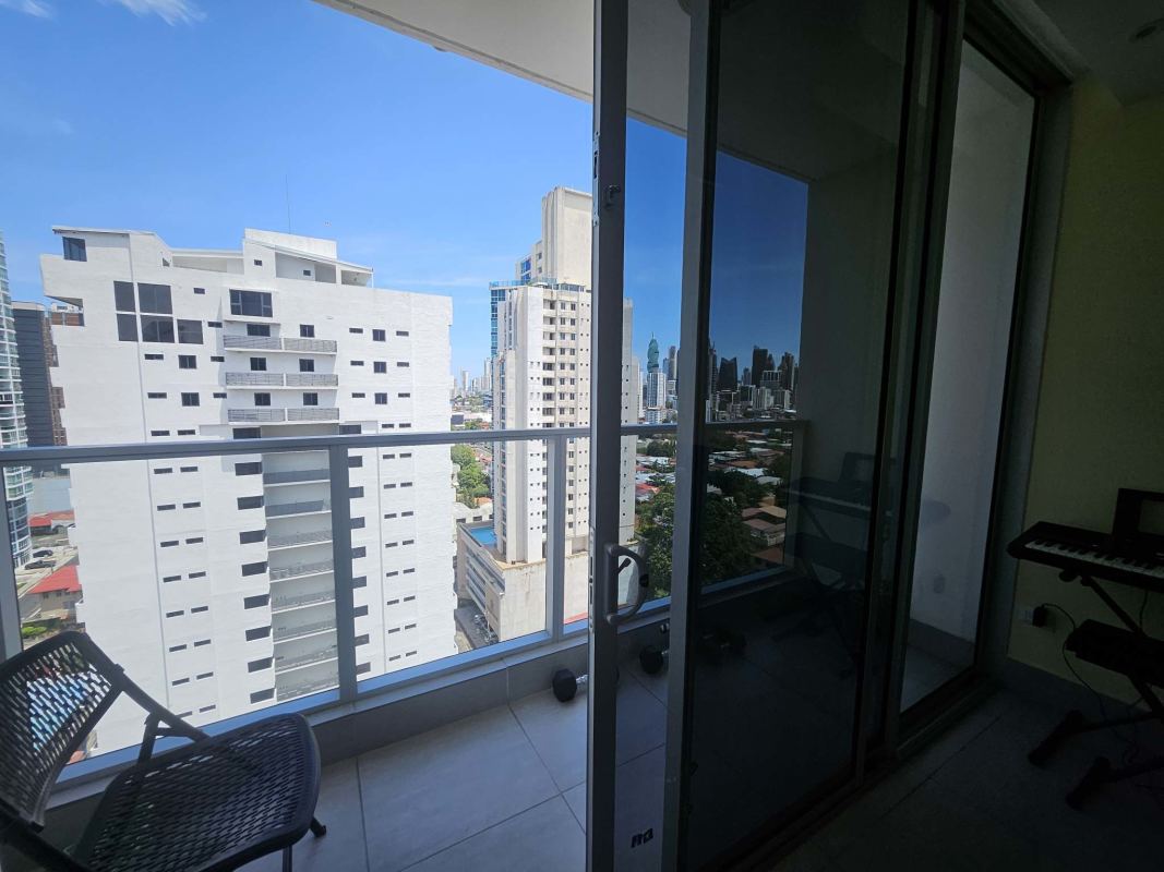 Bedroom with blue wall, large window, closet Jade Tower Panama City Panama