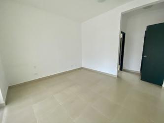 Tropical pool area with sun loungers palm trees in PH Founders Playa Blanca beachfront condo Panama