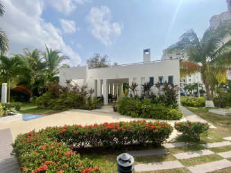 Bright open living dining room with large windows in Playa Blanca PH Founders beachfront apartment Panama