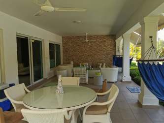 Large bedroom with garden view windows and en-suite bath in luxury Bijao beach house Panama