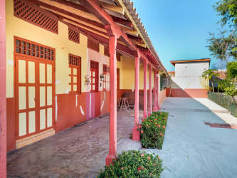 Two exterior doors with glass panels under covered roof in Las Tablas house for sale Panama