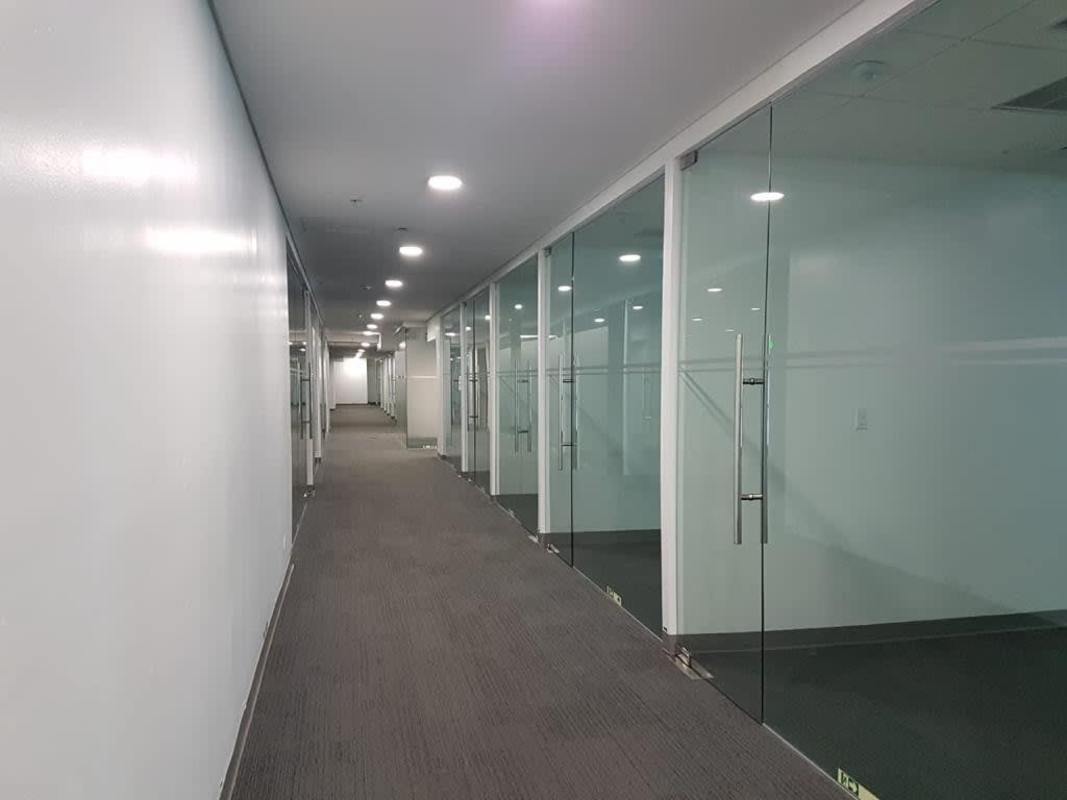 Modern open workspace with glass wall divisions Torre Mapfre Costa del Este Panama City