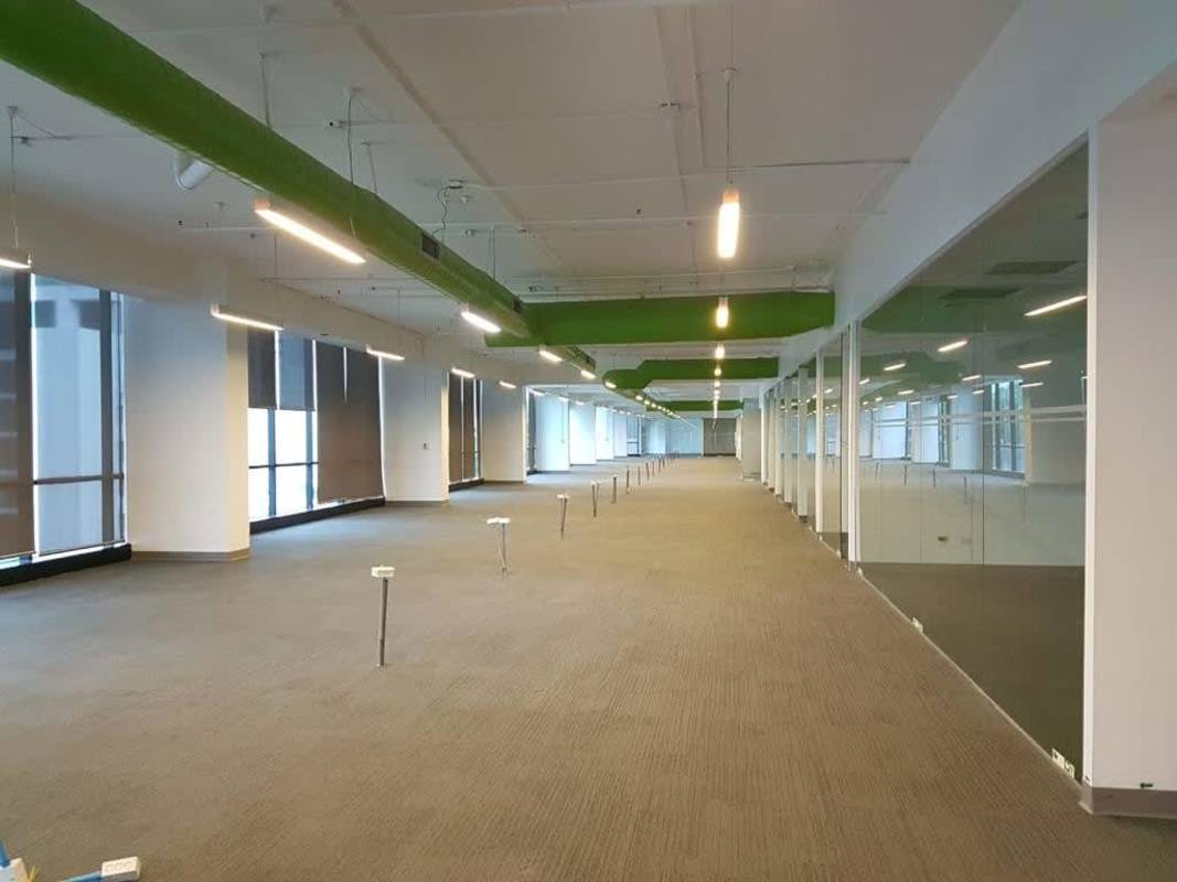 Reception with pendant lighting wood counter light walls Torre Mapfre Costa del Este Panama