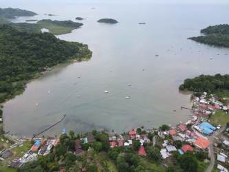 Caribbean oceanfront with yachts and islands near Puerto Lindo land for sale