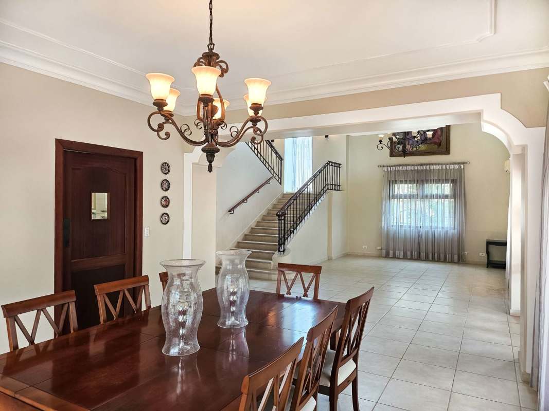 Spacious master bedroom with large windows, tile floors, ensuite bath in Camino de Cruces Clayton Panama