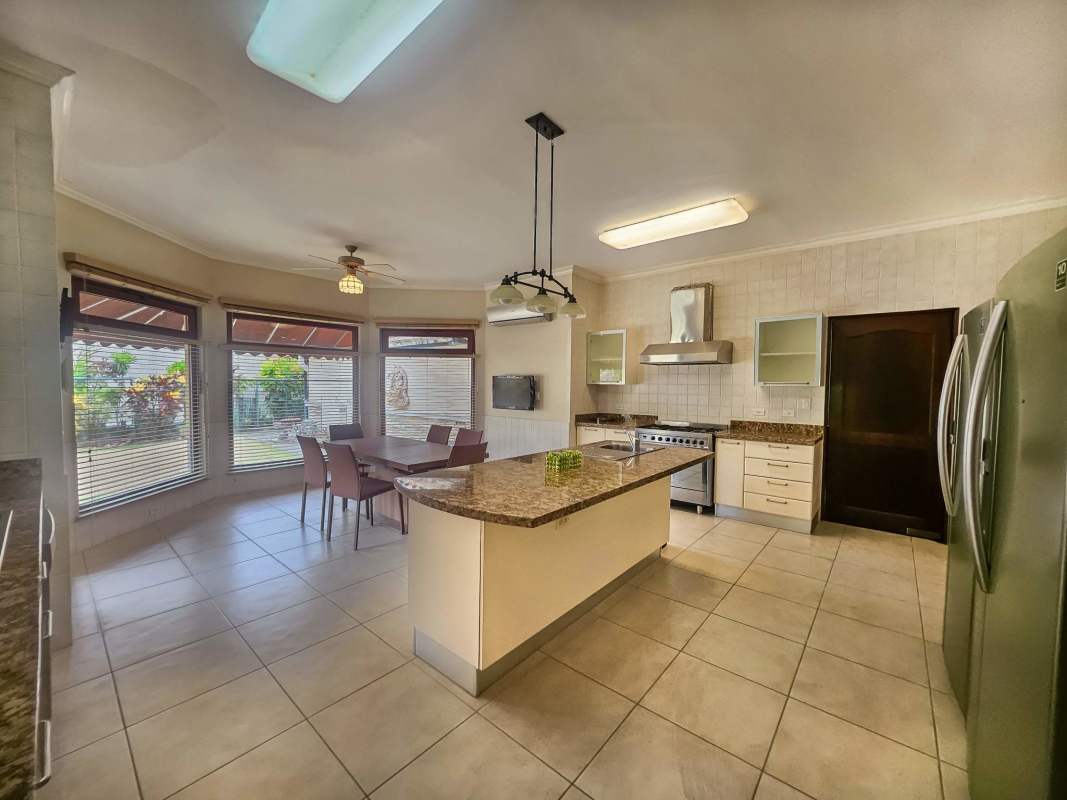 Upscale bathroom with corner bathtub, double vanity, round window, glass shower in Camino de Cruces Clayton Panama