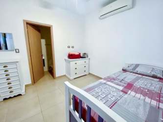 Minimalist bedroom furniture tile floor AC beachfront Santa Clara Residences Panama