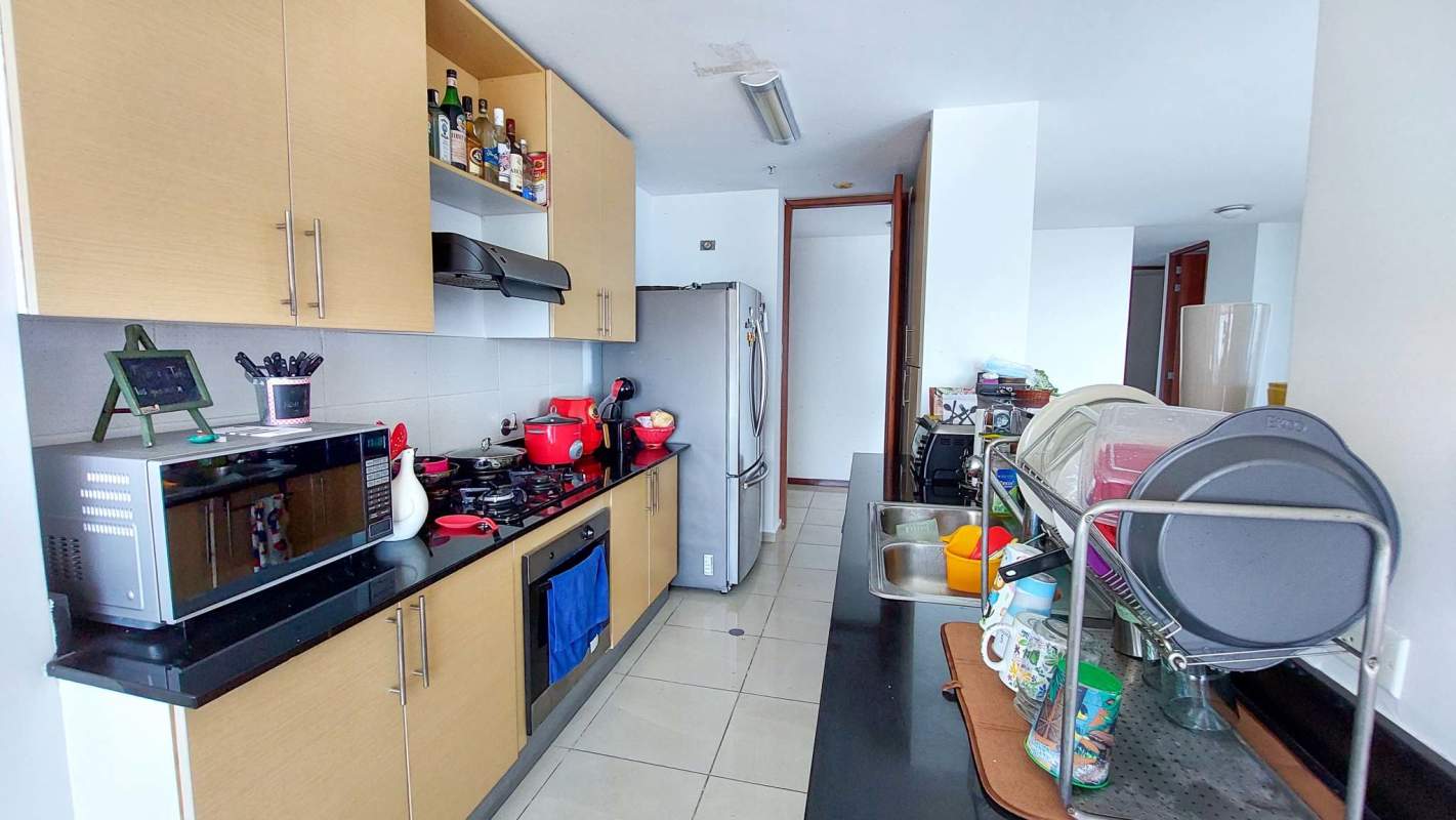 Modern kitchen with granite countertops cabinets and appliances at PH Cabomarzo San Francisco Panama