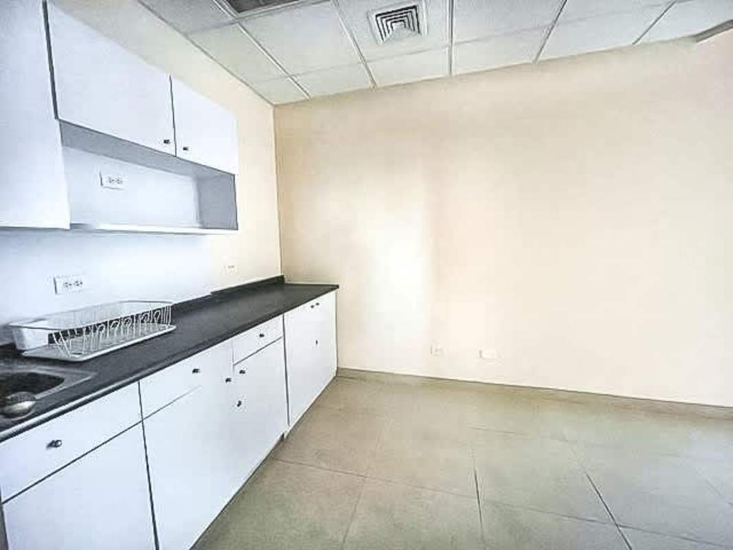 Office interior with city skyline view large window blinds in Torre Banco General Marbella Panama