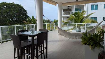 Large bedroom with balcony access and ocean views at PH Bijao Resort Panama