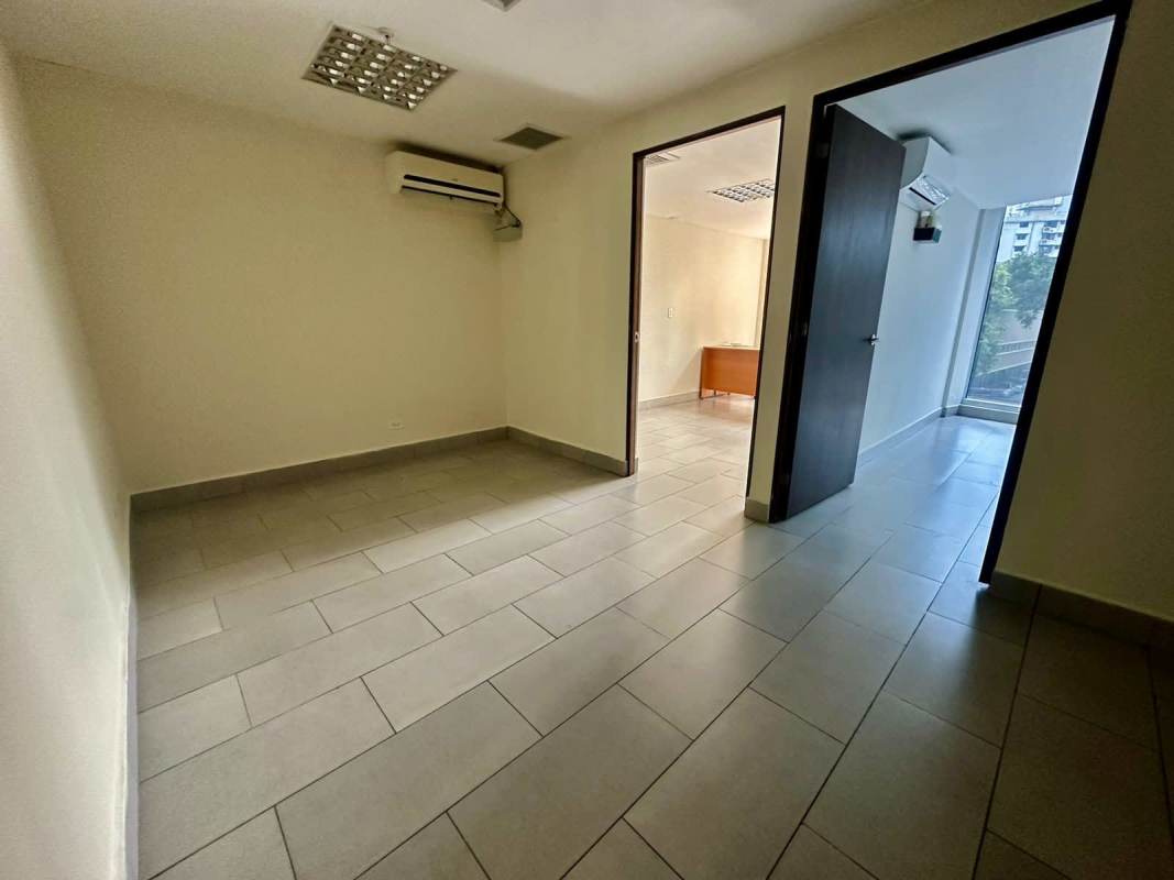 Secondary office space with large windows tiled floors at PH Denovo Obarrio Panama