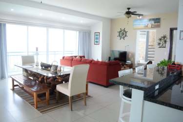 Spacious living area with access to balcony and Pacific ocean views in Barcovento Penthouse San Carlos Panama