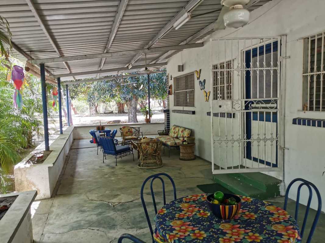 Shaded backyard with mature trees and open grassy spaces in Santa Clara beach community Panama