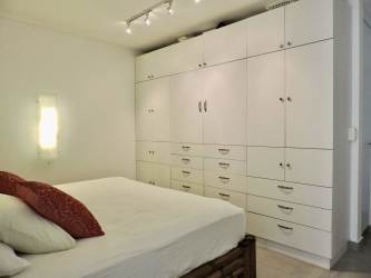 Contemporary kitchen with stainless appliances and dining area in Punta Chame condo