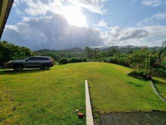 Secluded house amid dense mountain forest with cloudy sky Portobelo Panama