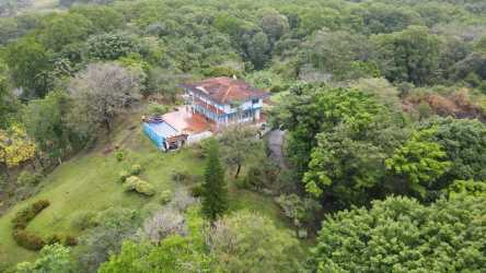 Aerial view of private residence with balcony, garden surrounded by dense tropical forest Portobelo
