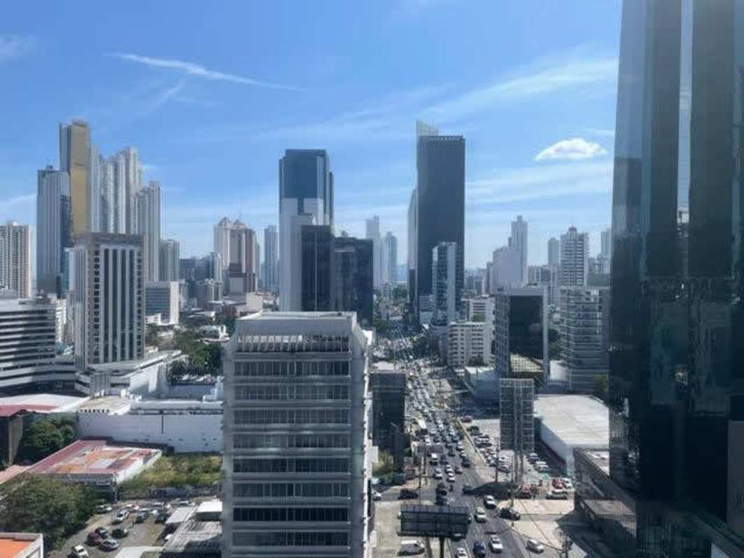Shell office interior with floor-to-ceiling windows and concrete columns in Revolution Tower Panama