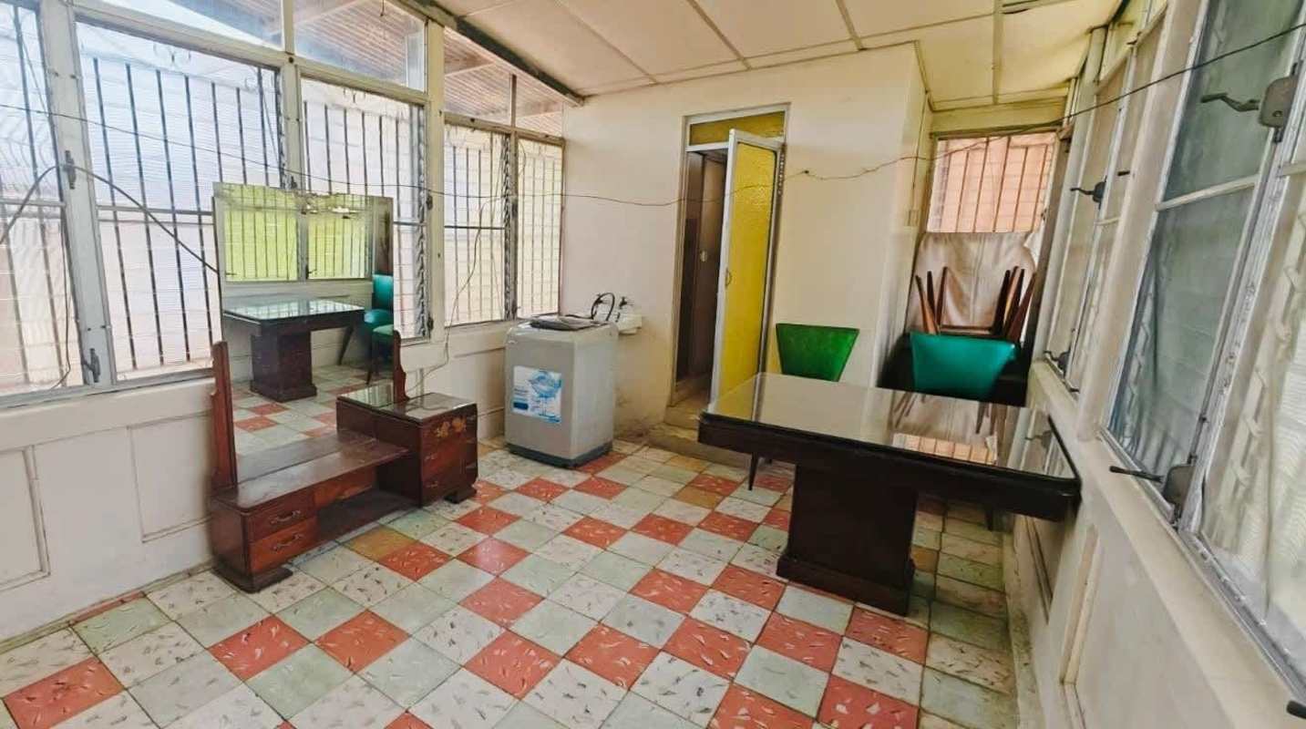 Concrete walkways, lawn and patio area beside rental buildings Panama City