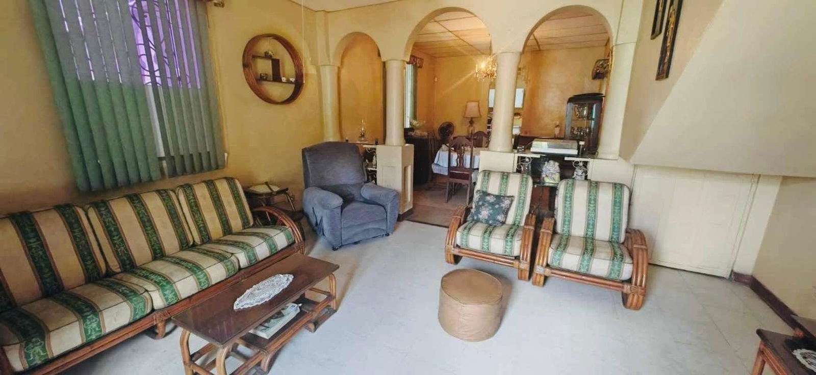 Traditional living dining room with arched design and furniture in multi-unit complex Panama