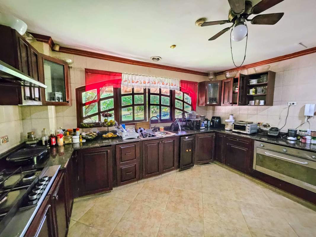 Covered terrace with bar and lush private garden Albrook Panama home for sale