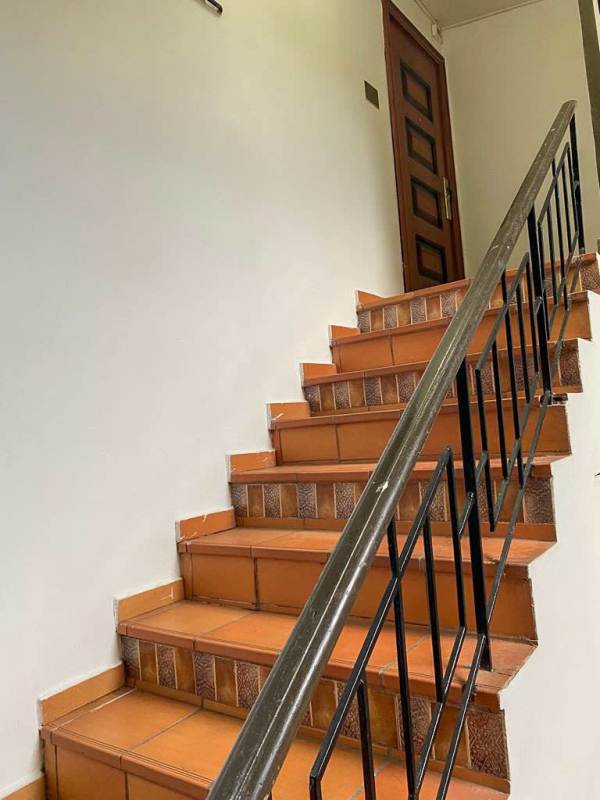 Spacious living and study room with bookshelf and large windows La Cresta Panama