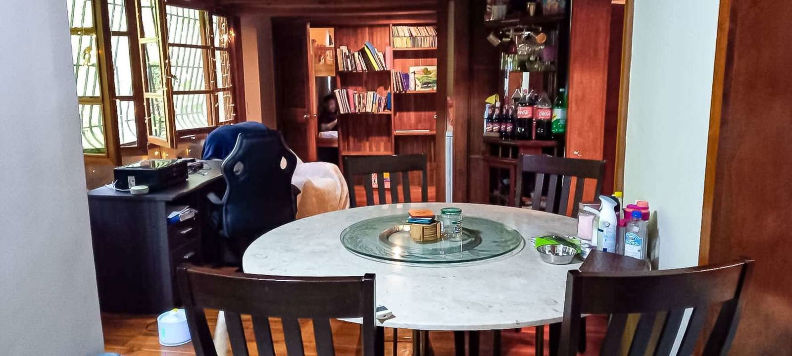 Balcony with plastic chairs, hanging plants, garden view La Cresta Panama