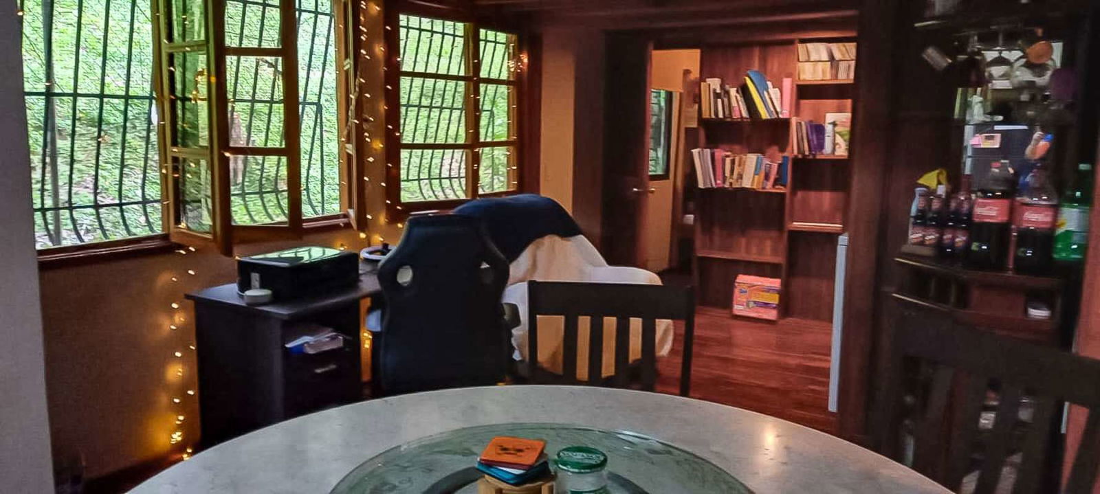 Modern kitchen with dining table, cabinets, large windows Panama City