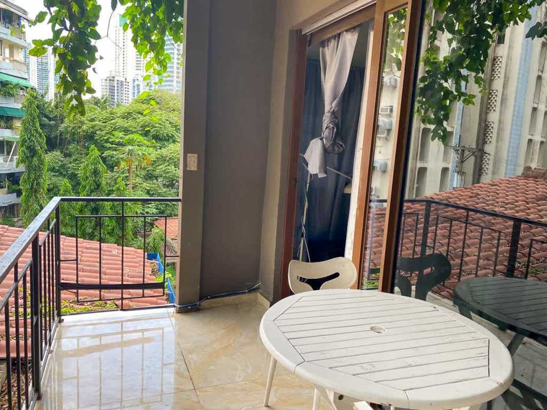 Dining table and office corner with wood shelves La Cresta apartments