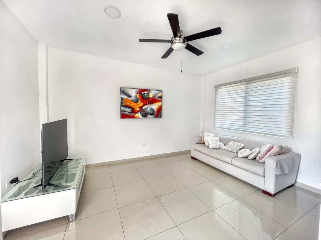 Spacious living room with marble floors, ceiling fan and garden views San Francisco Panama